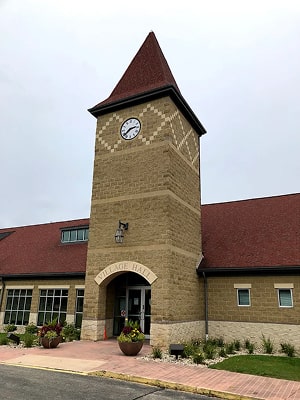 germantown village hall clock tower building with tan bricks